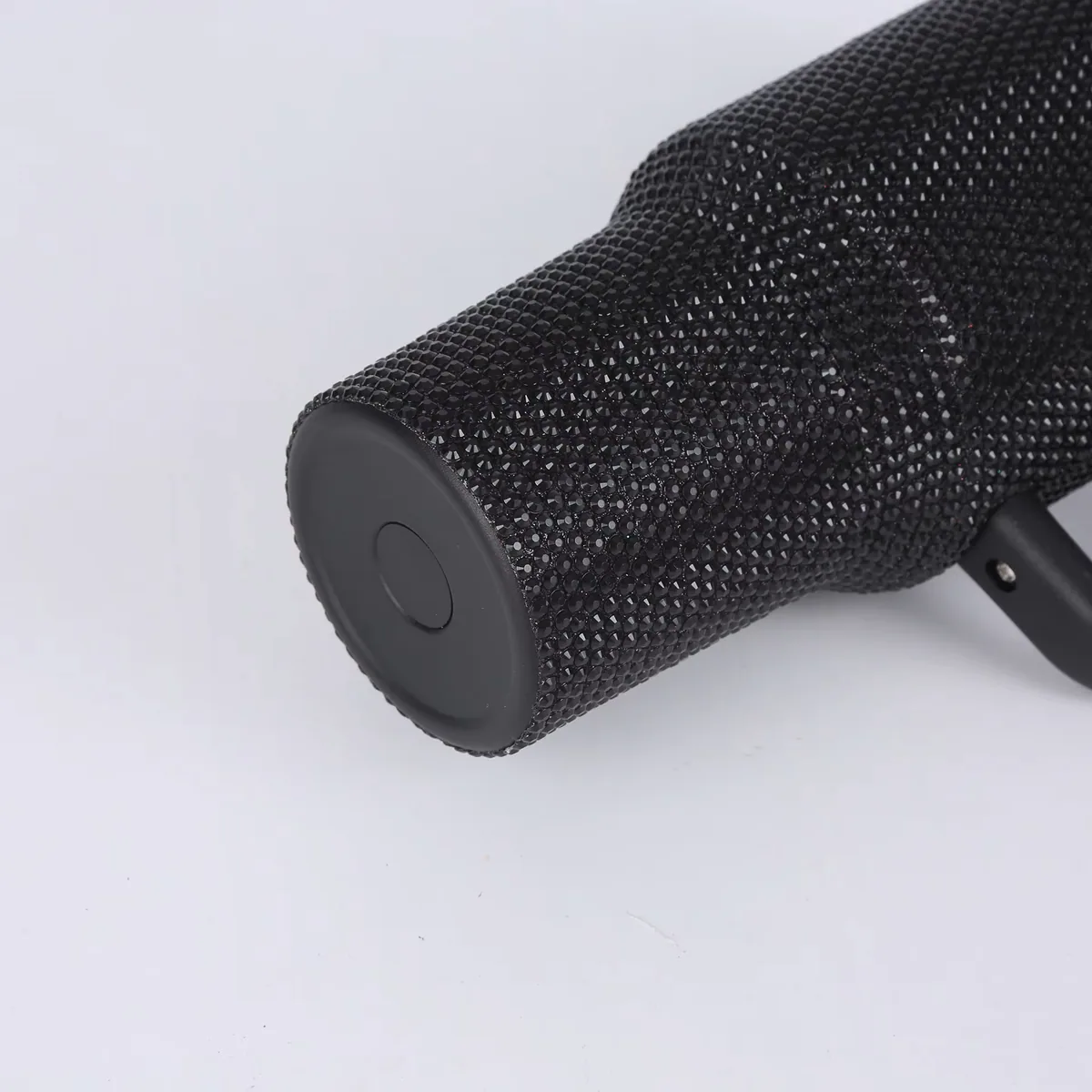 Close-up of black rhinestone decoration on handled tumbler