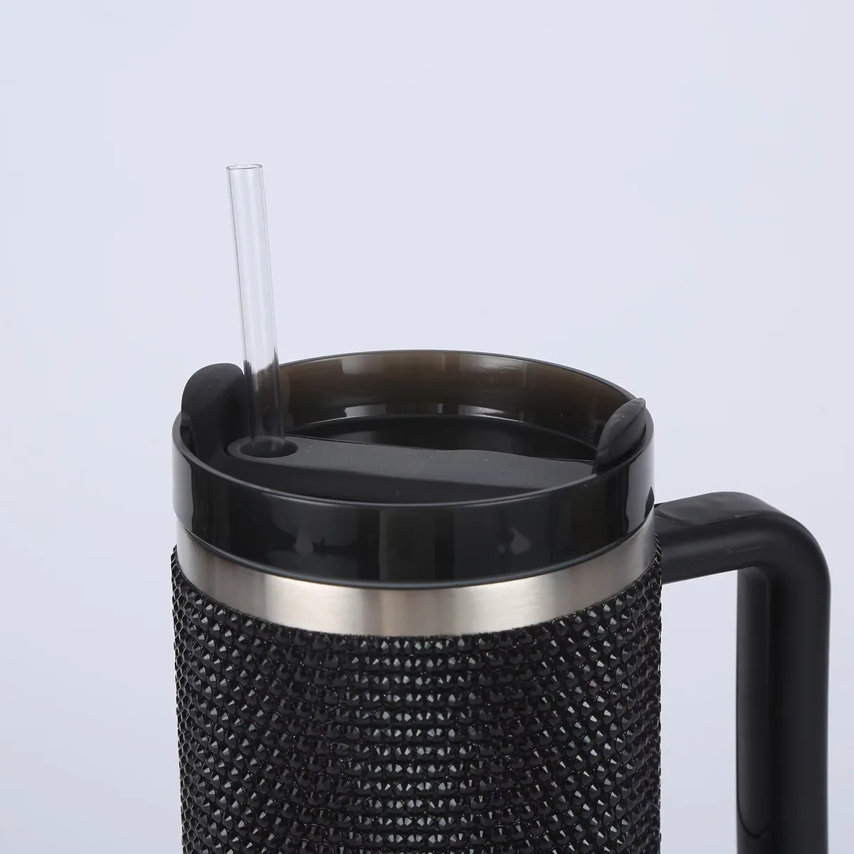 Black handled rhinestone tumbler lid and straw detail