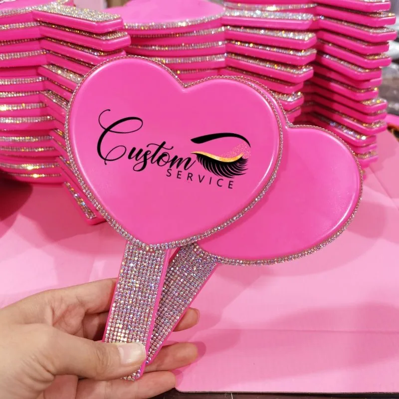 Pink heart-shaped hand mirror with rhinestone handle and custom logo