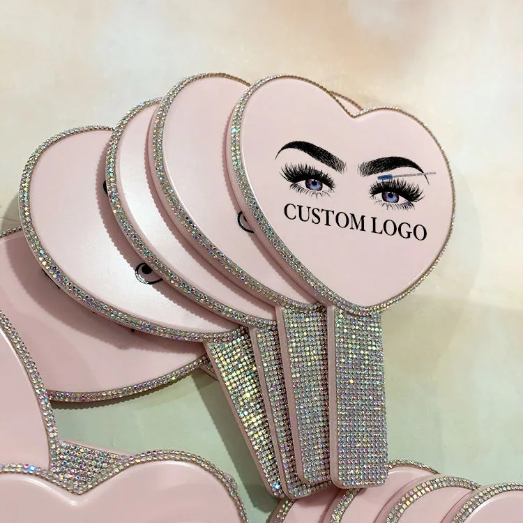 Light pink heart-shaped hand mirror with rhinestone handle and custom logo