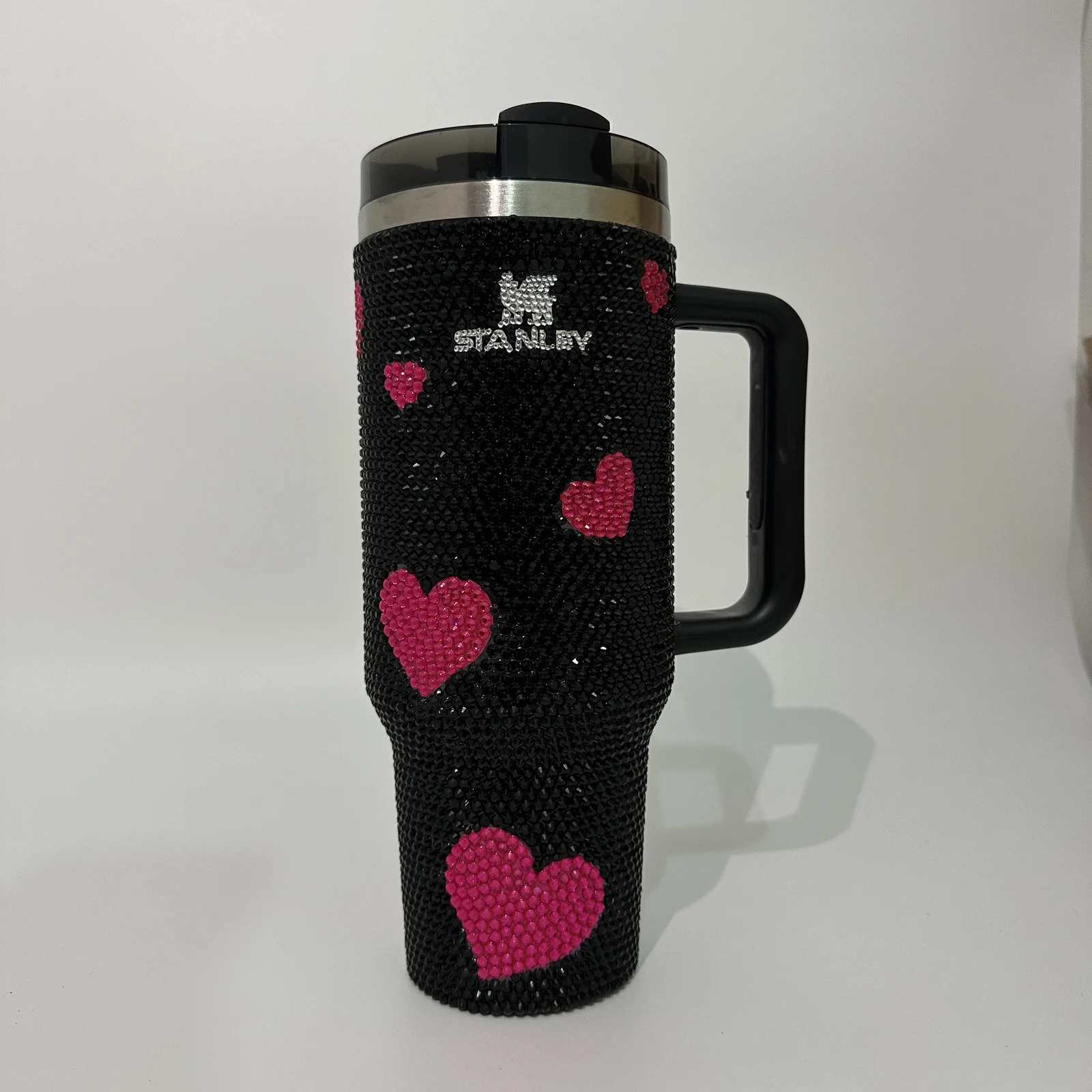 Black rhinestone tumbler with pink heart decoration
