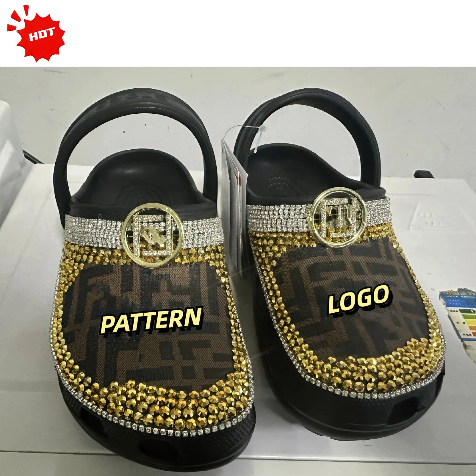 Rhinestone bling clogs with a logo-style decoration